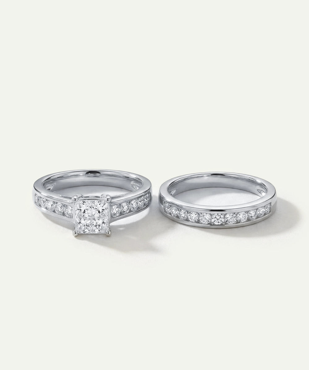 White gold princess-cut diamond engagement ring and matching channel-set wedding band set.