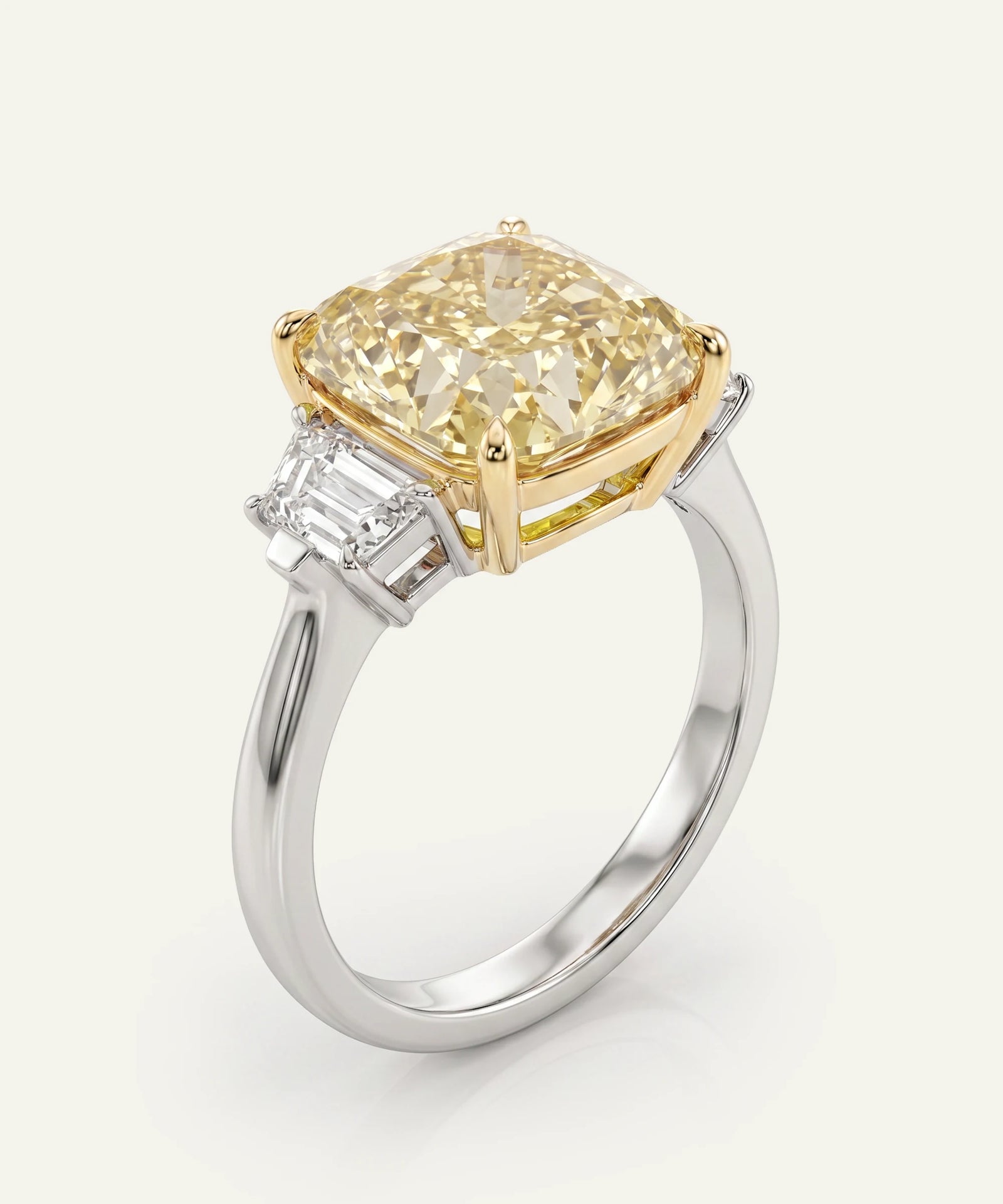 Ring with a yellow diamond and silver band on a white background