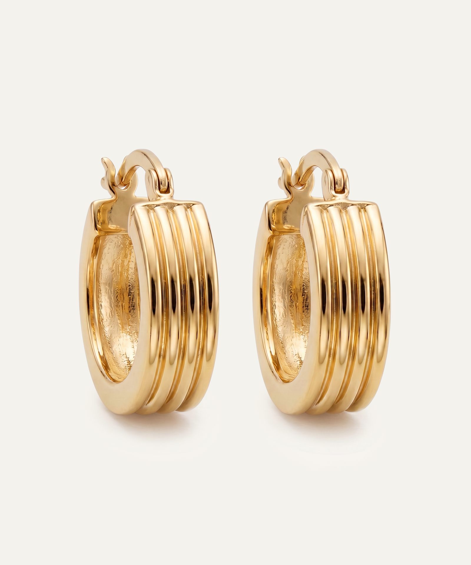 Gold hoop earrings on a white background