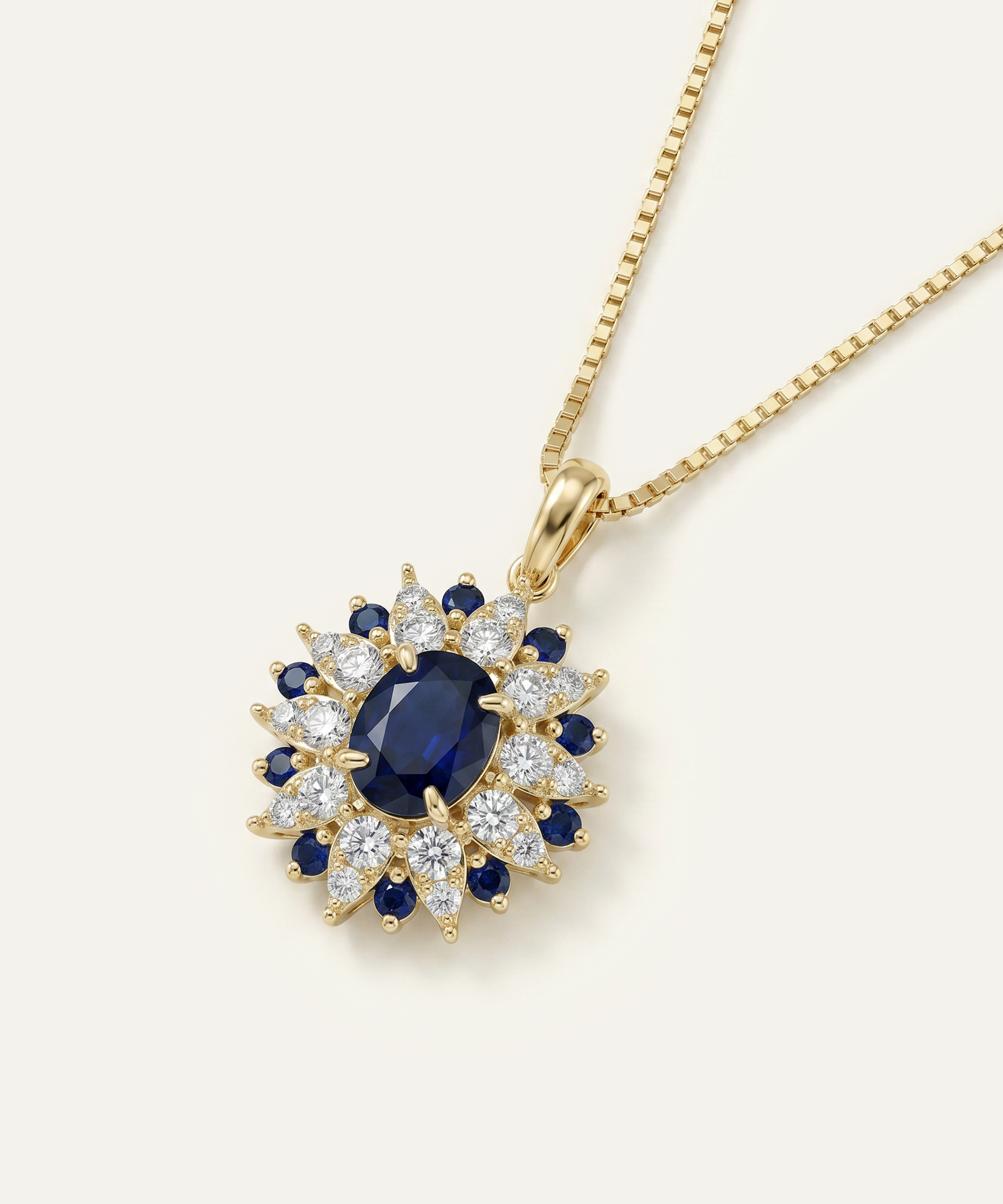 Gold necklace with a blue gemstone pendant on a white background