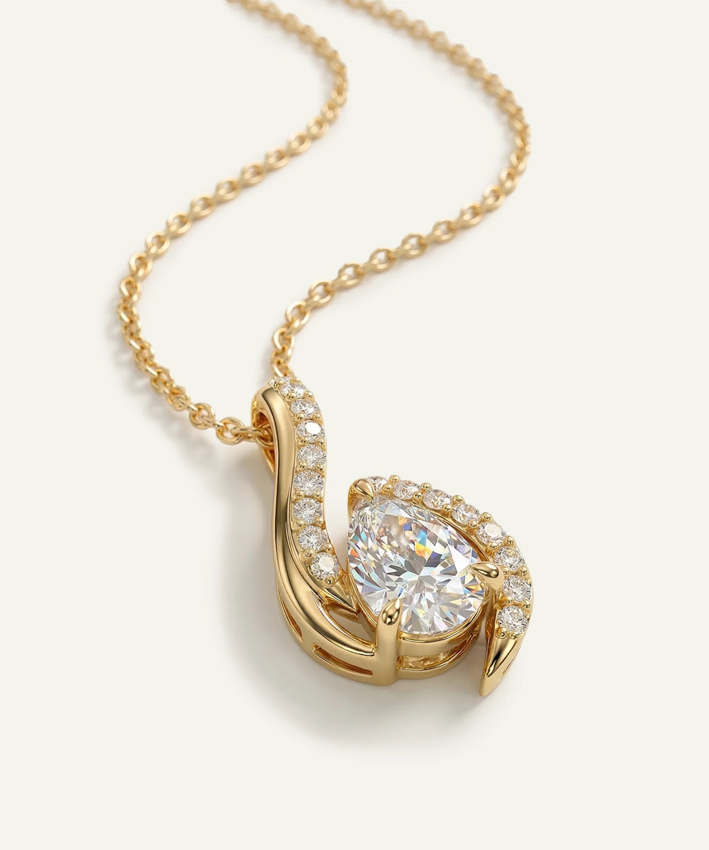 Gold necklace with a diamond pendant on a light background