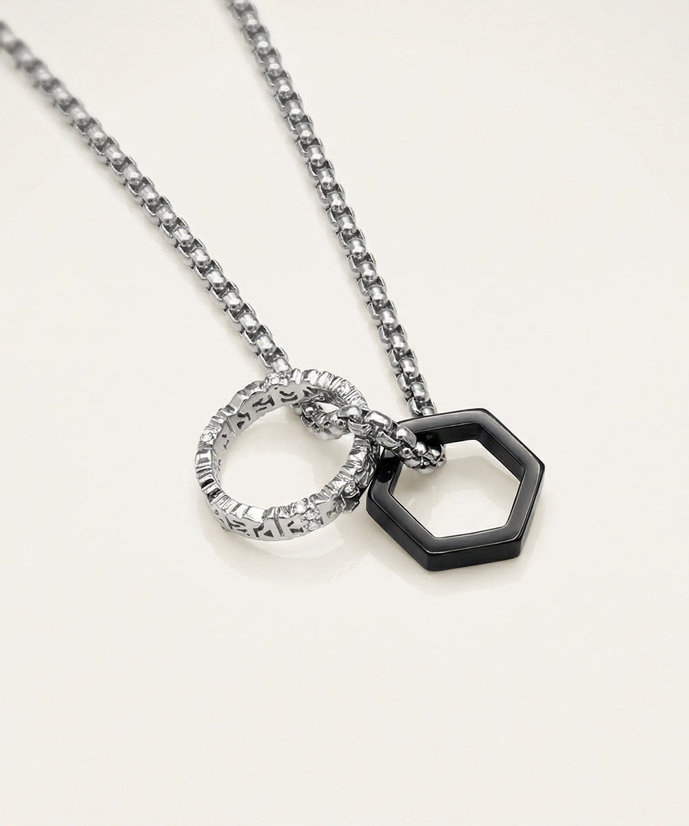 Necklace with interlocking circular pendants on a light background