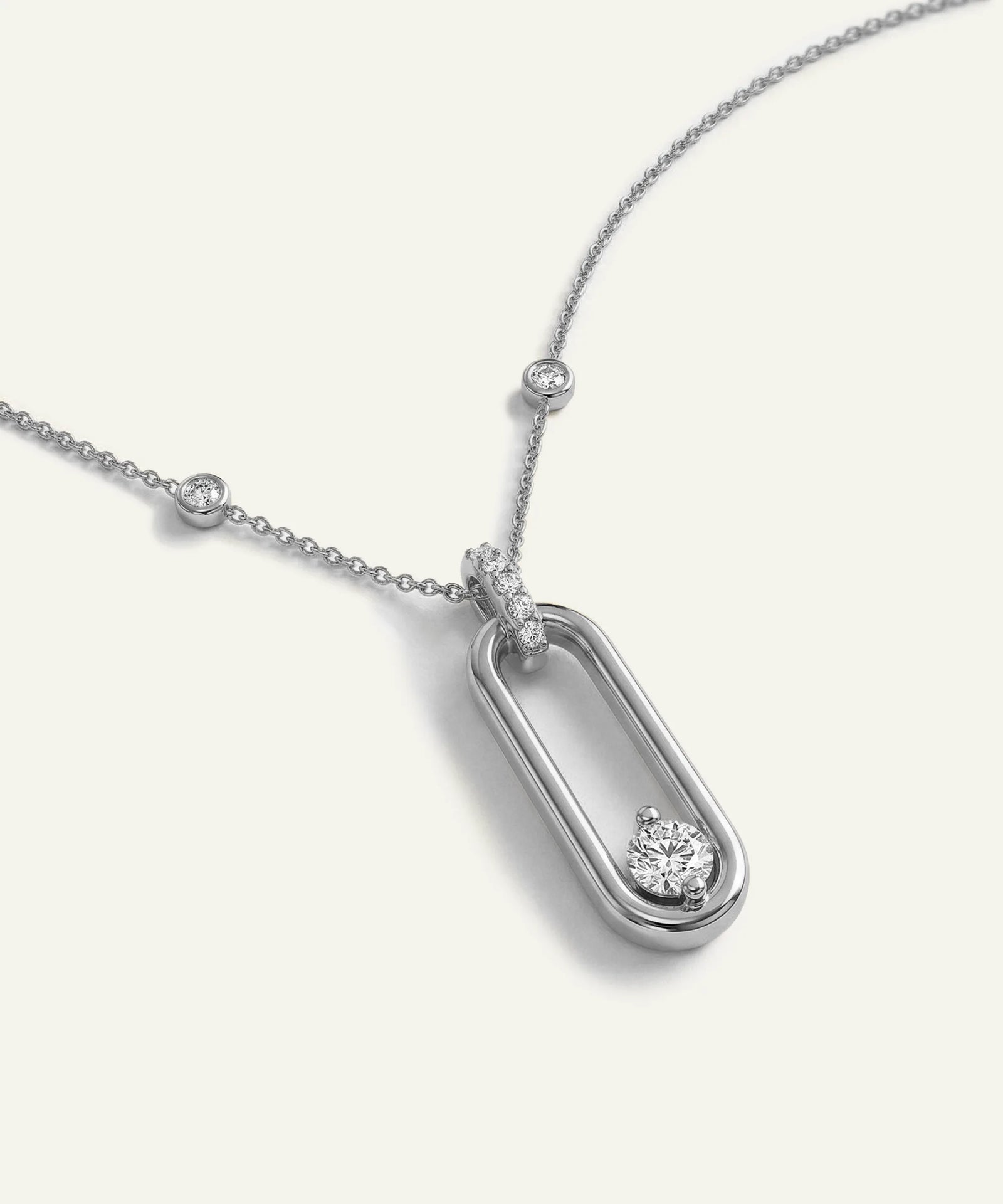 Silver necklace with a pendant on a white background