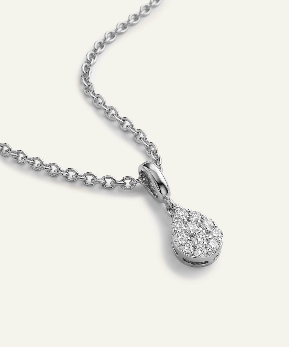 Silver teardrop pendant necklace on a white background