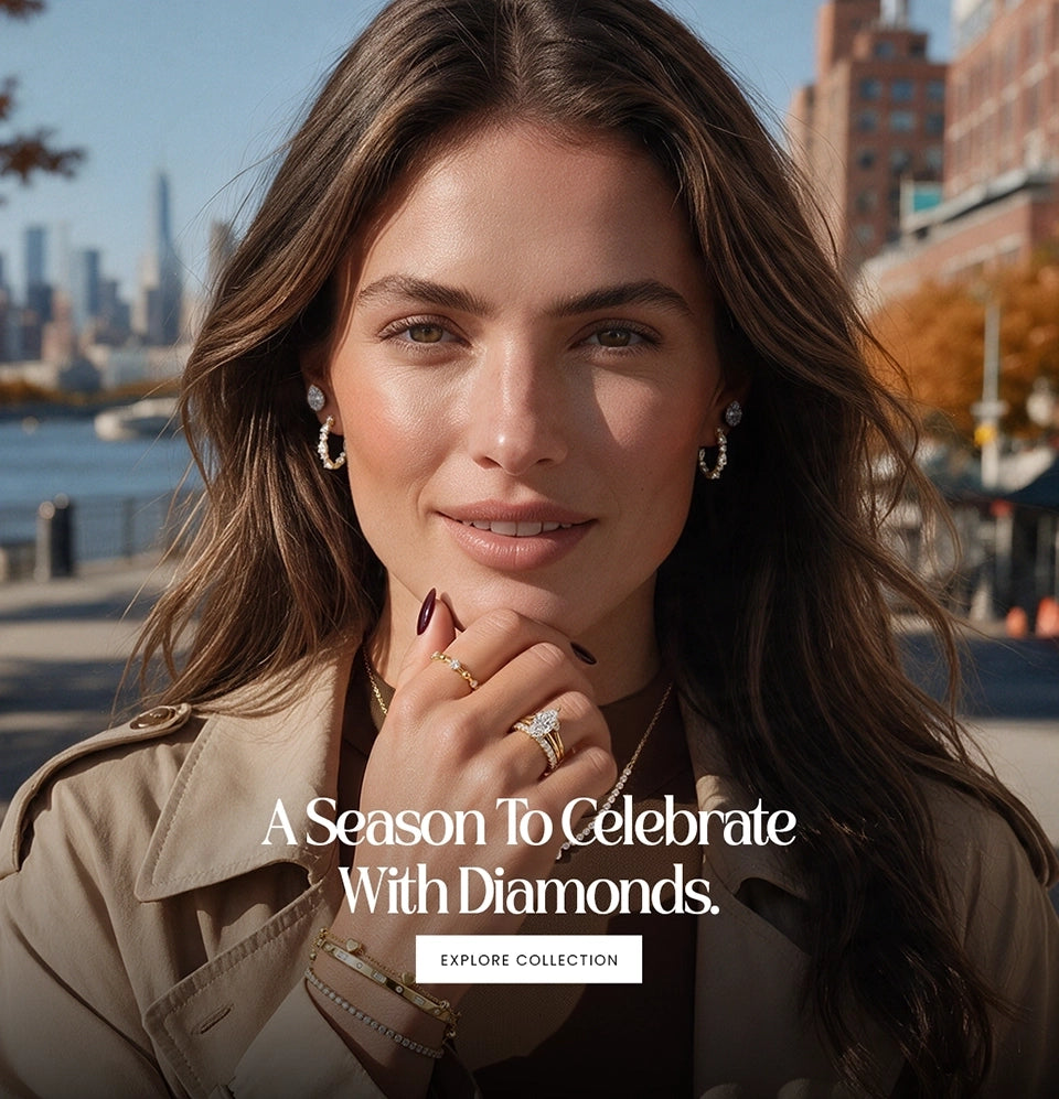 A woman outdoors wearing hoop earrings and rings, with a city skyline and water in the background. White text overlays read 'A Season To Celebrate With Diamonds.