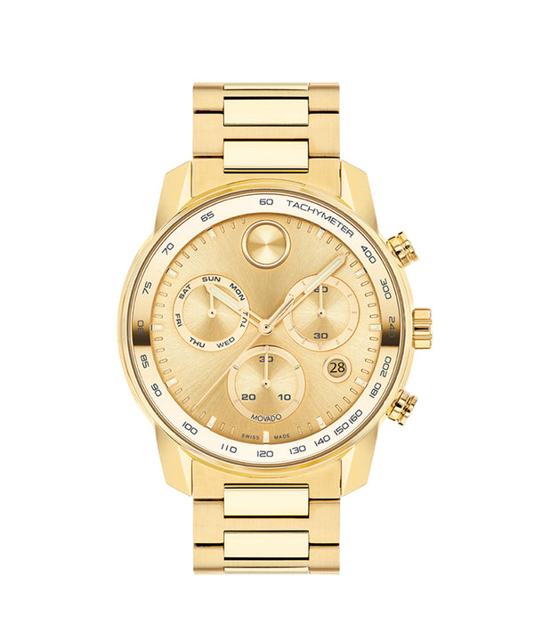 Gold wristwatch with detailed face on a white background