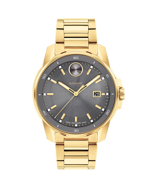 Gold wristwatch with a dark gray dial on a white background