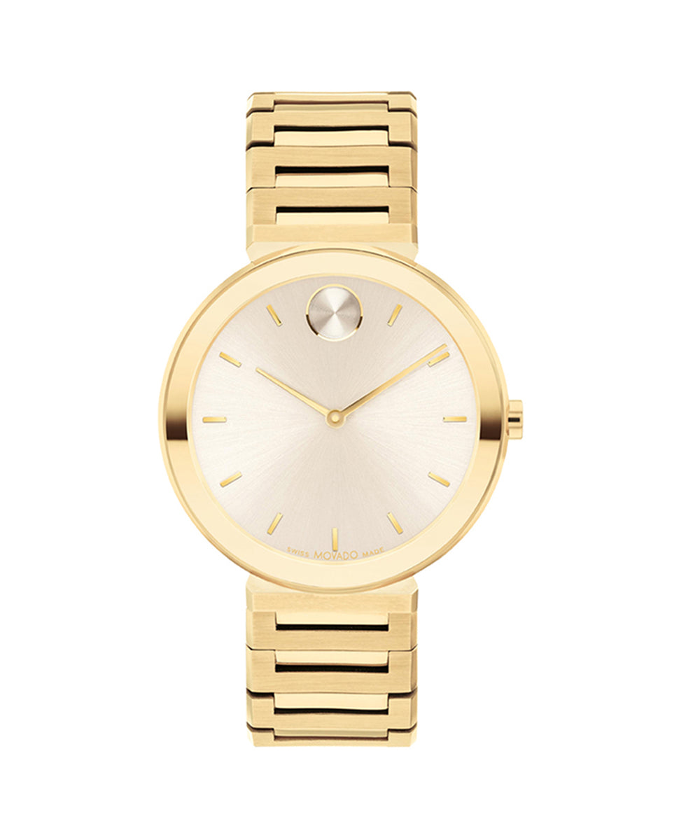 Gold wristwatch with a white face on a white background