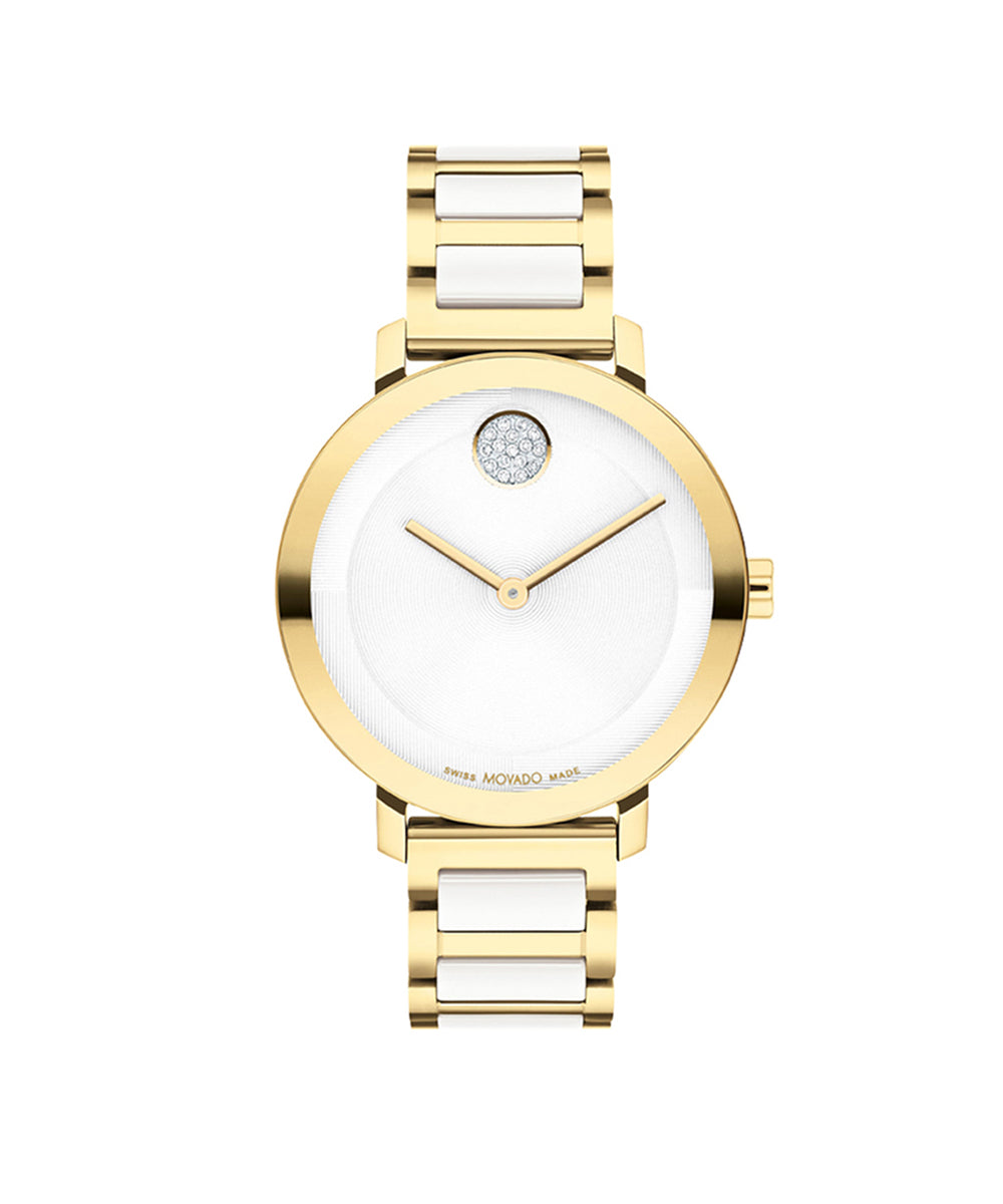 Gold and white watch with a diamond-like center on a white background