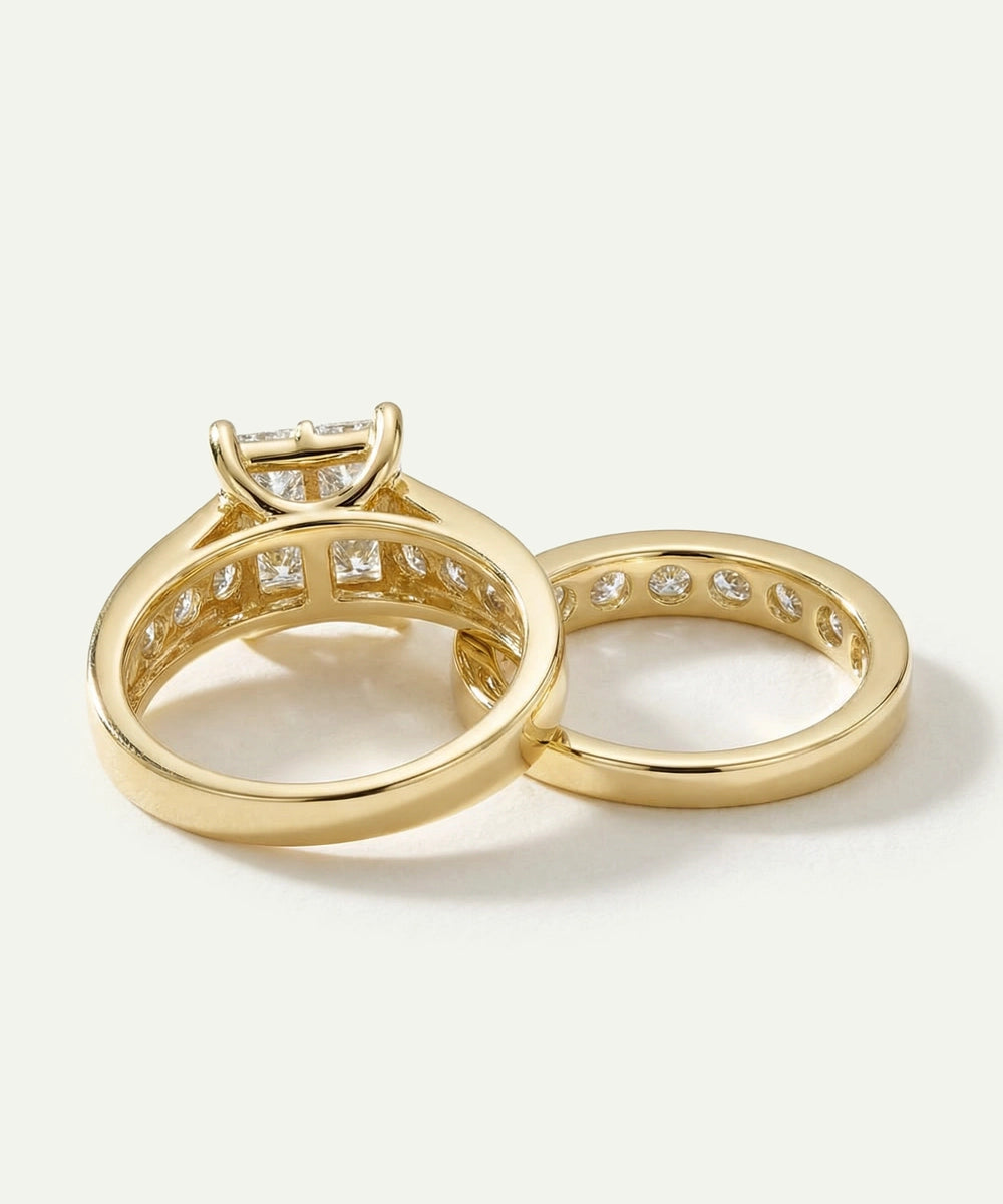 Two gold rings with diamond accents on a light background