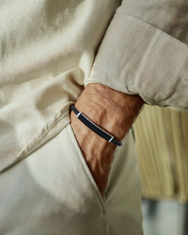 Close-up of a person wearing a bracelet on a blurred background
