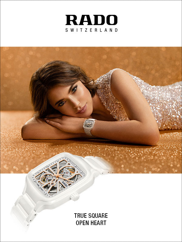 RADO Switzerland watch advertisement featuring a woman in a sparkly white dress resting on a glittery gold surface, with a white square open-heart watch shown at the bottom alongside the text 'TRUE SQUARE OPEN HEART'.