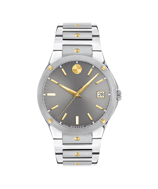 Silver and gold watch with gray dial on a white background