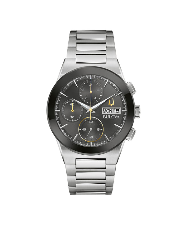 Bulova watch with silver bracelet and black dial on a white background