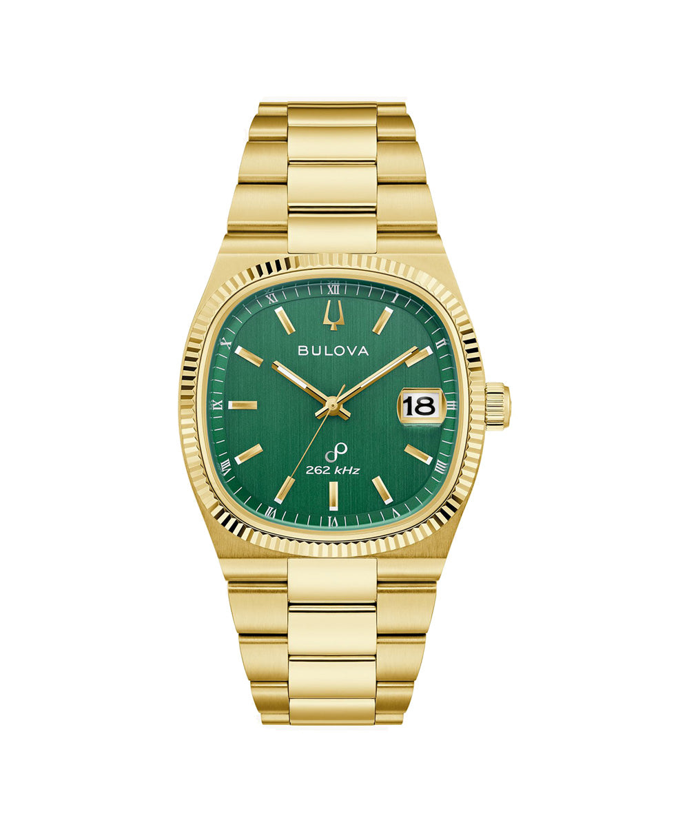 Gold watch with green dial on a white background