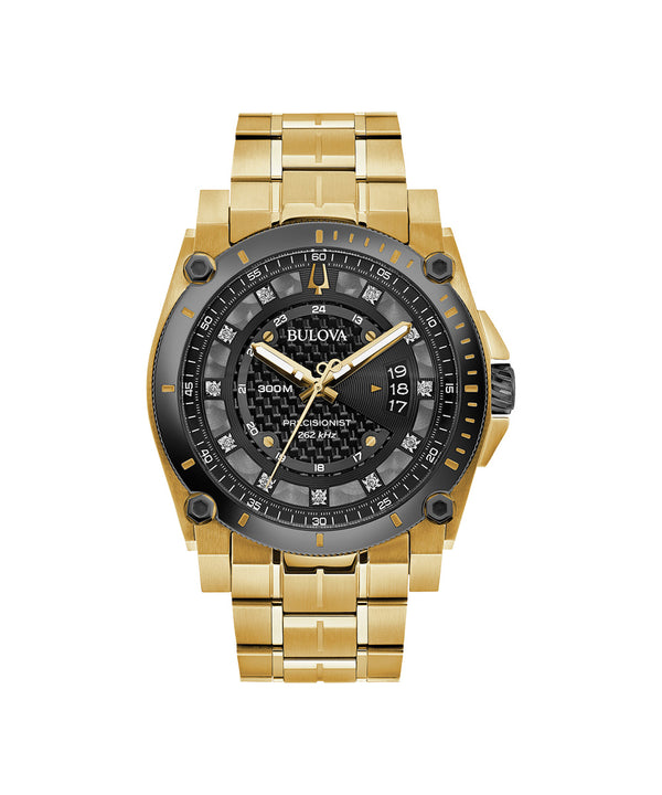 Gold and black Bulova watch on a white background