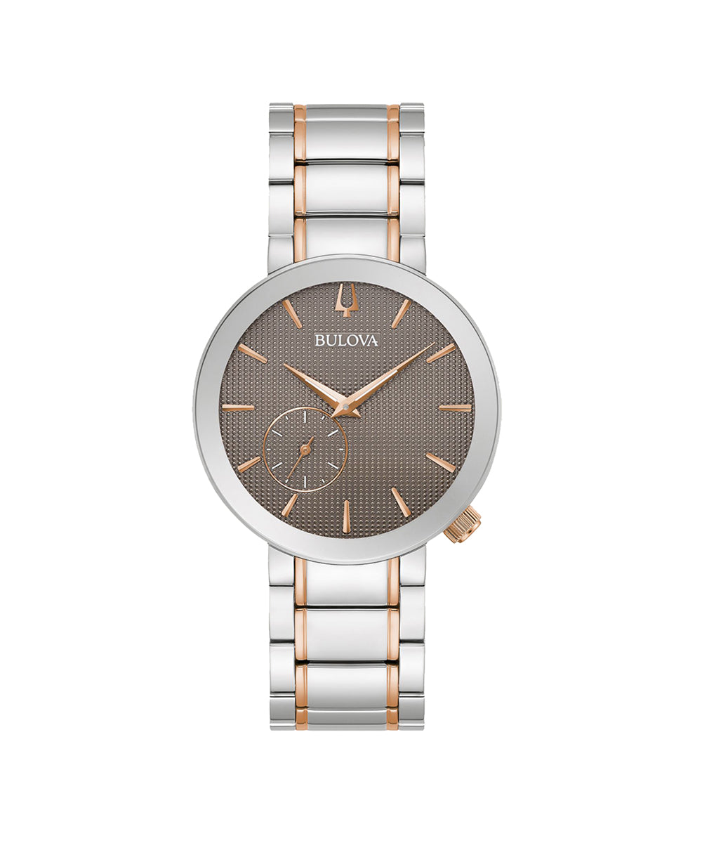 Bulova watch with silver and rose gold band on white background