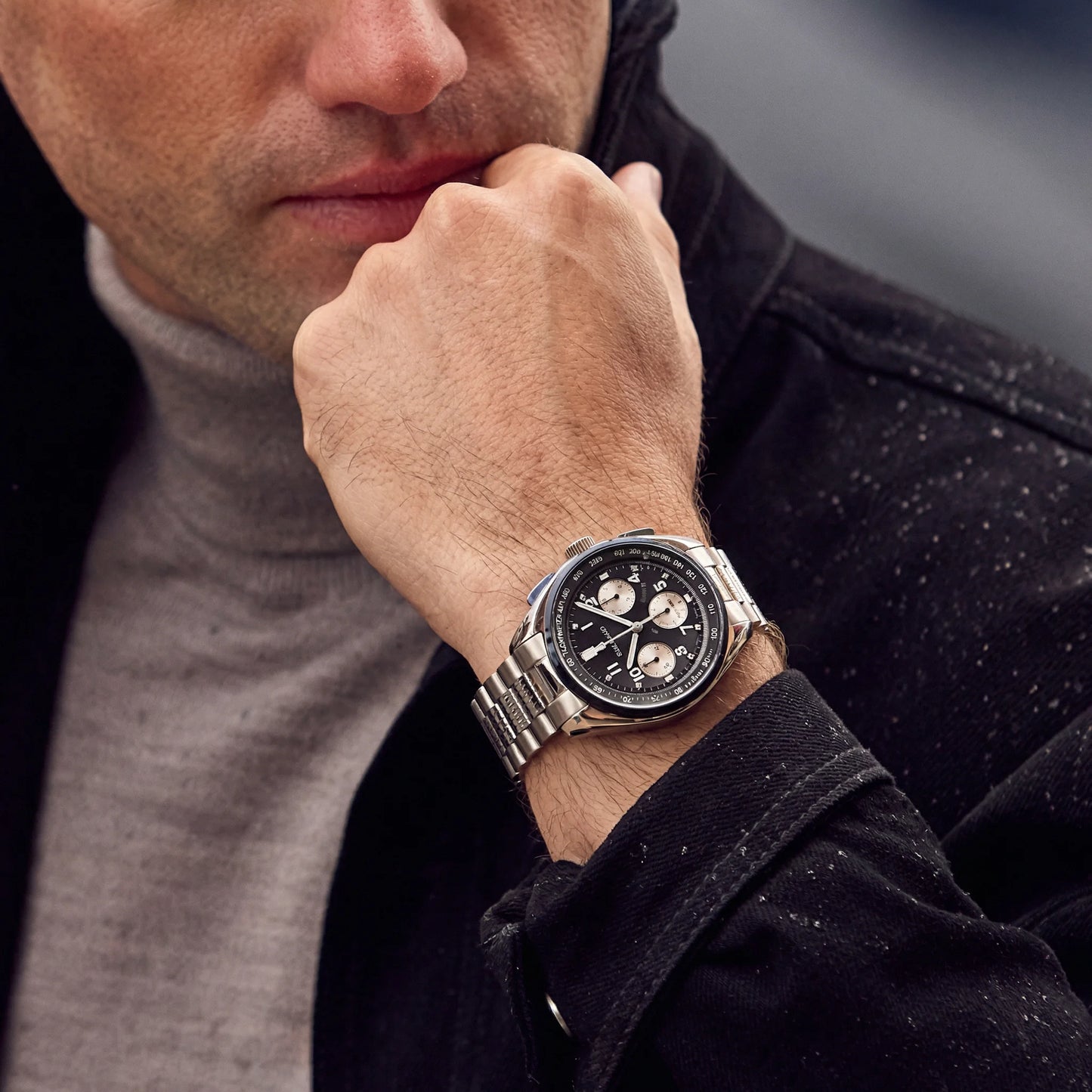Men's stainless steel chronograph watch with a black and silver panda dial layout.