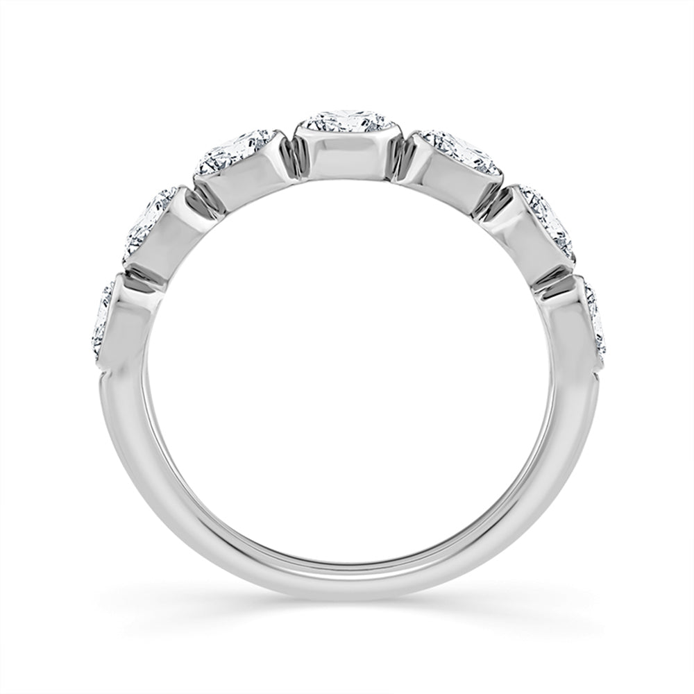 A silver-toned diamond band ring with a row of round-cut diamonds set in a prong setting, shown against a plain white background.