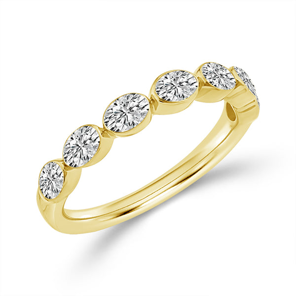 Gold ring with five diamonds on a white background