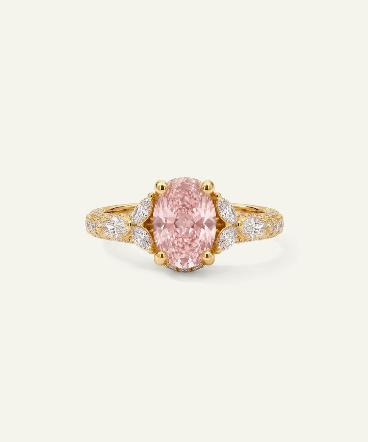 A yellow gold ring featuring a large oval-cut pink gemstone center stone, flanked by marquise-cut diamond accents and a pavé diamond band on a plain off-white background.