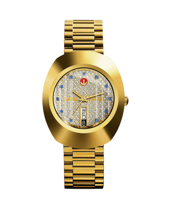 Gold wristwatch with a decorative face on a white background