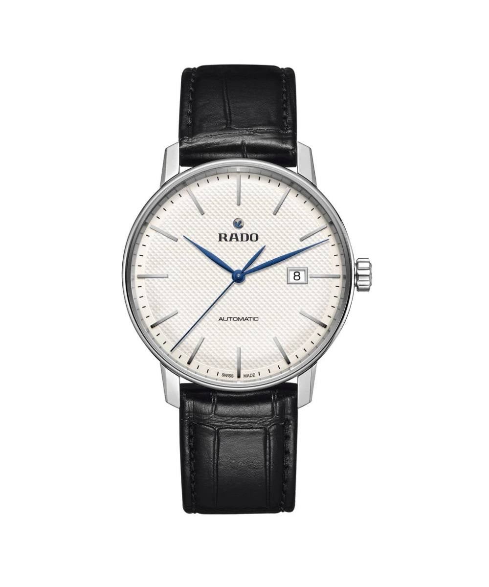 Rado watch with black leather strap and white dial on a white background