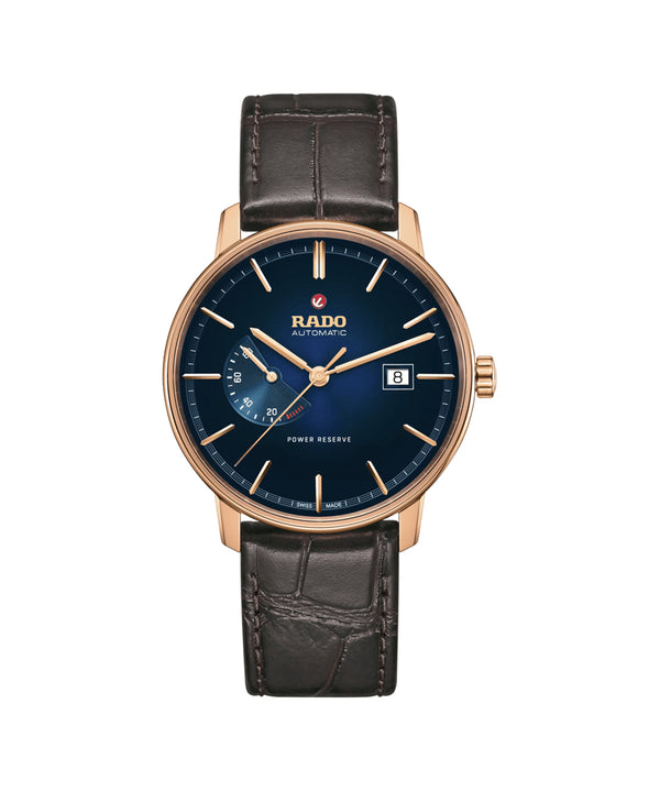 Rado watch with black leather strap and blue dial on a white background