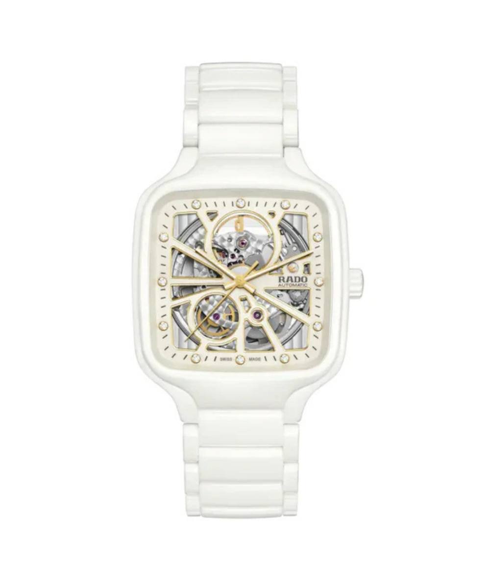 White watch with a transparent face on a white background
