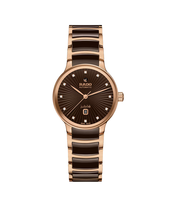 Rose gold and brown ceramic watch with Rado branding on a white background