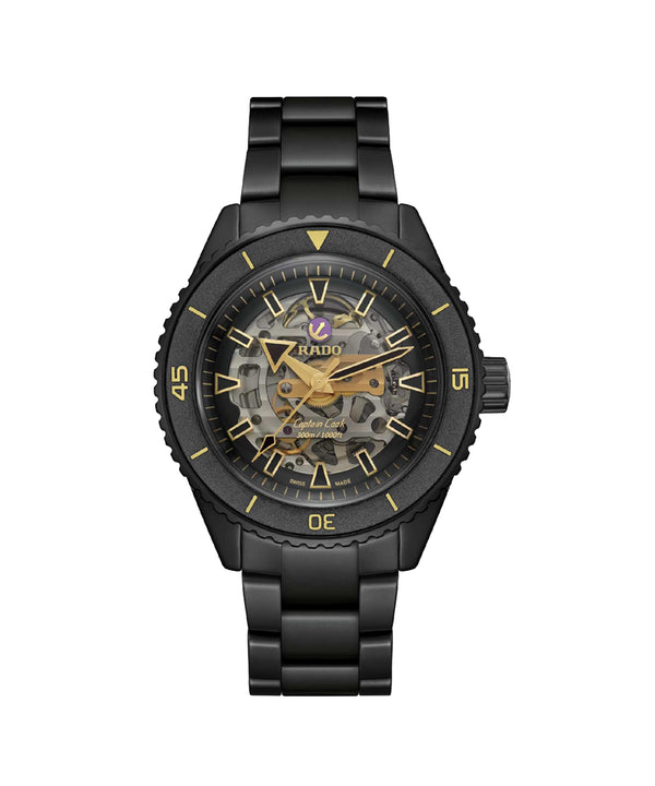 Black Rado watch with visible mechanical components on a white background