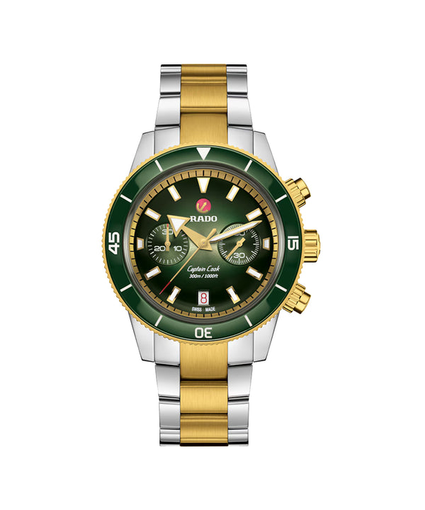 Watch with green face and gold accents on a white background