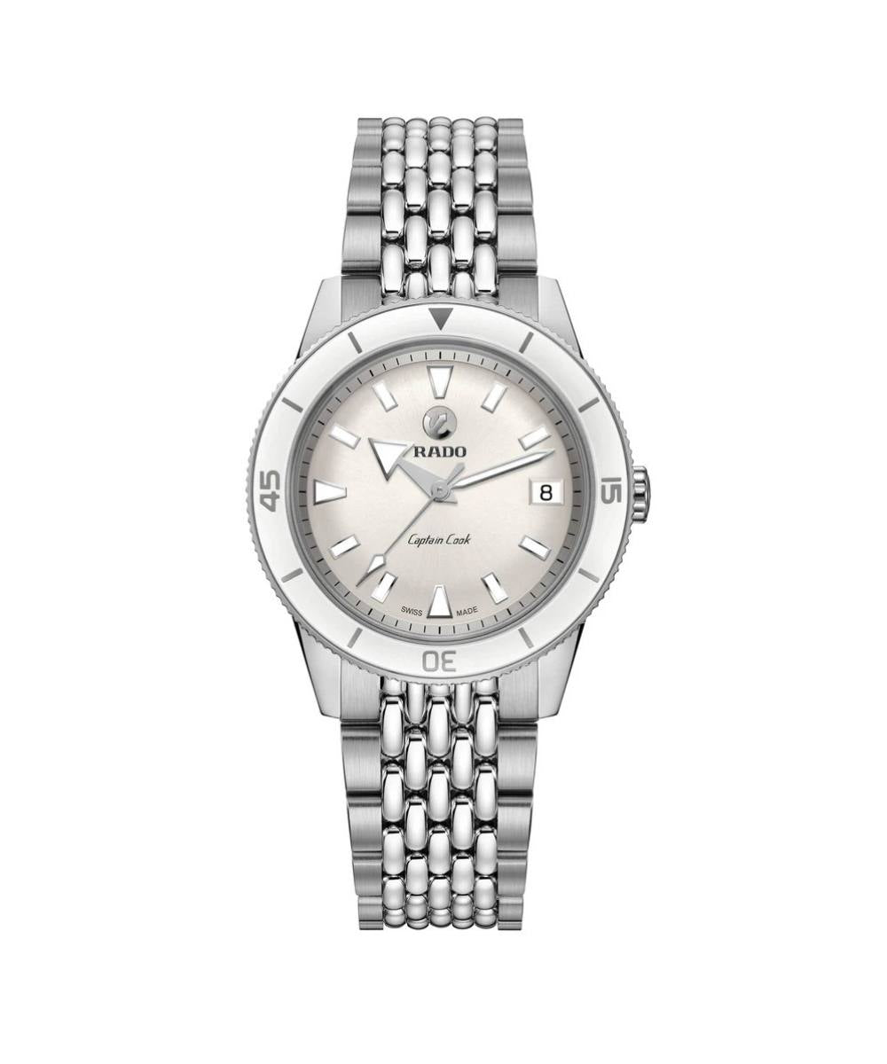 Silver watch with a white face on a white background