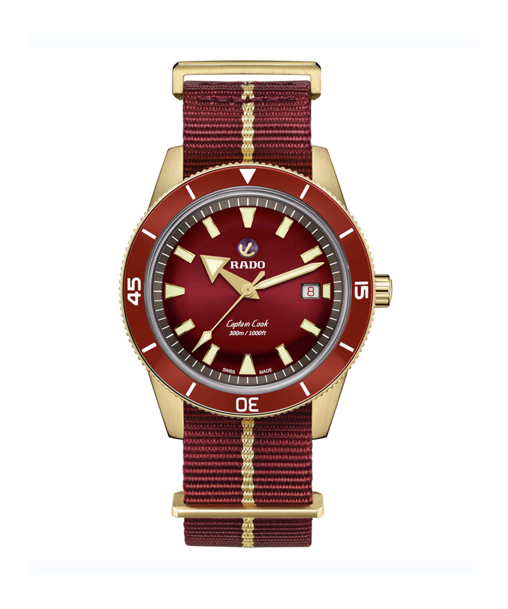 Watch with red face and maroon strap on a white background
