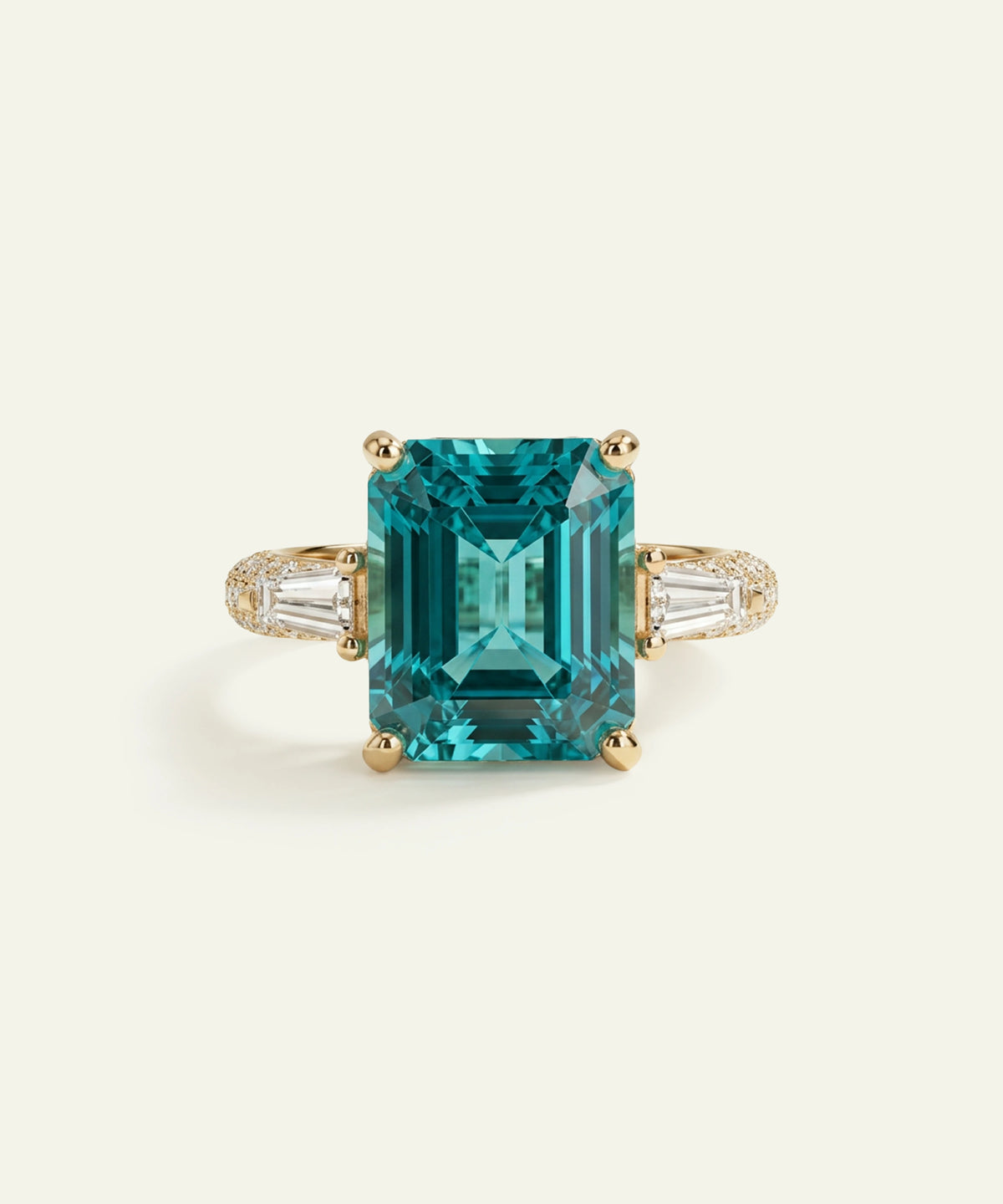A yellow gold ring featuring a large rectangular emerald-cut turquoise gemstone in a four-prong setting, flanked by baguette-cut and pavÃ©-set clear stones on a light cream background.