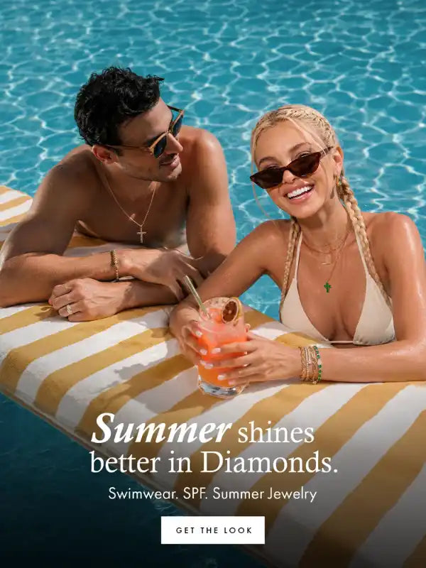 A man and a woman relax on a striped pool float in a swimming pool, wearing sunglasses and jewelry. Text on the left reads 'Summer shines better in Diamonds' and 'Swimwear: SPF Summer Jewelry'. - mobile