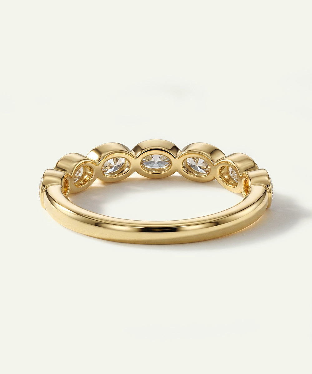Gold ring with diamonds on a white background