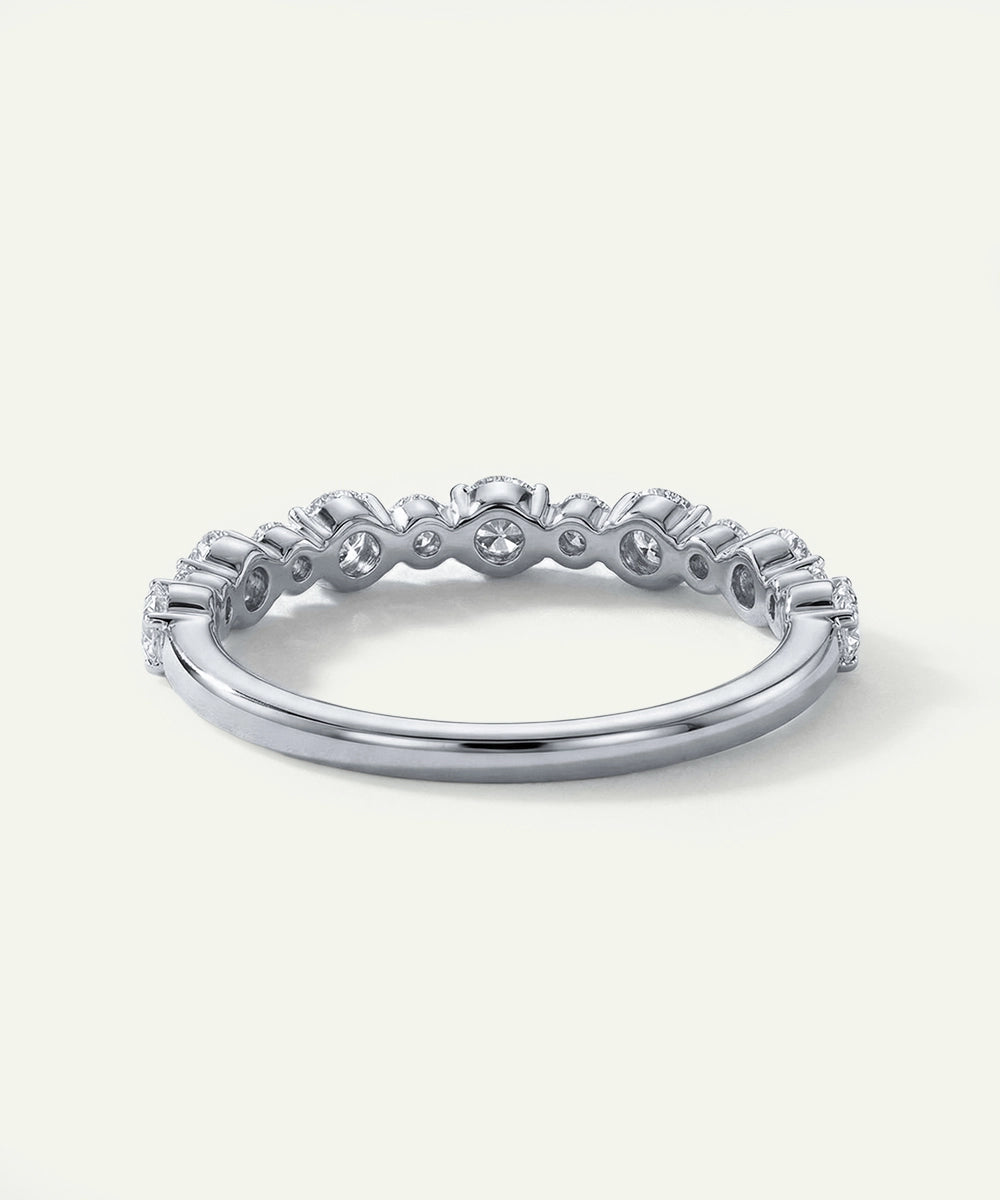 Silver ring with diamonds on a white background