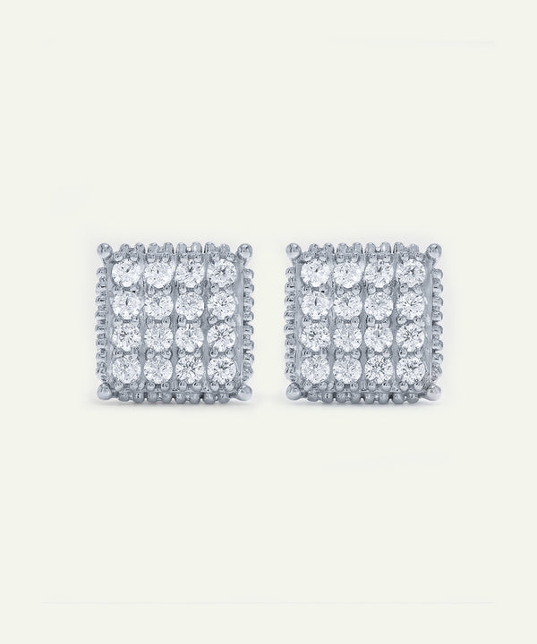 Pair of square-shaped diamond earrings on a white background