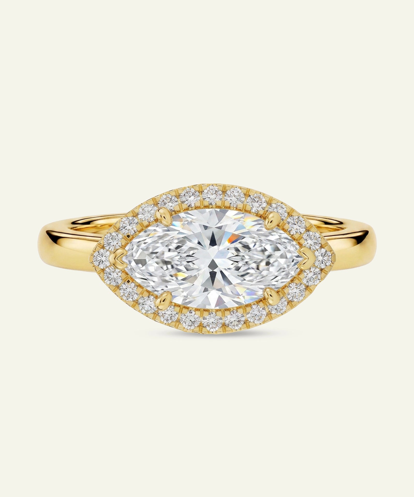 Gold ring with a large diamond and smaller diamonds around on a white background
