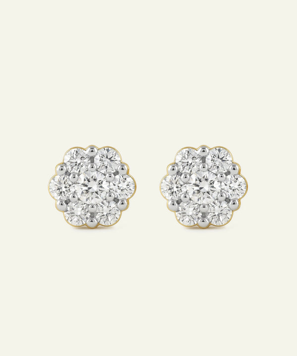 Pair of diamond stud earrings on a light gray background