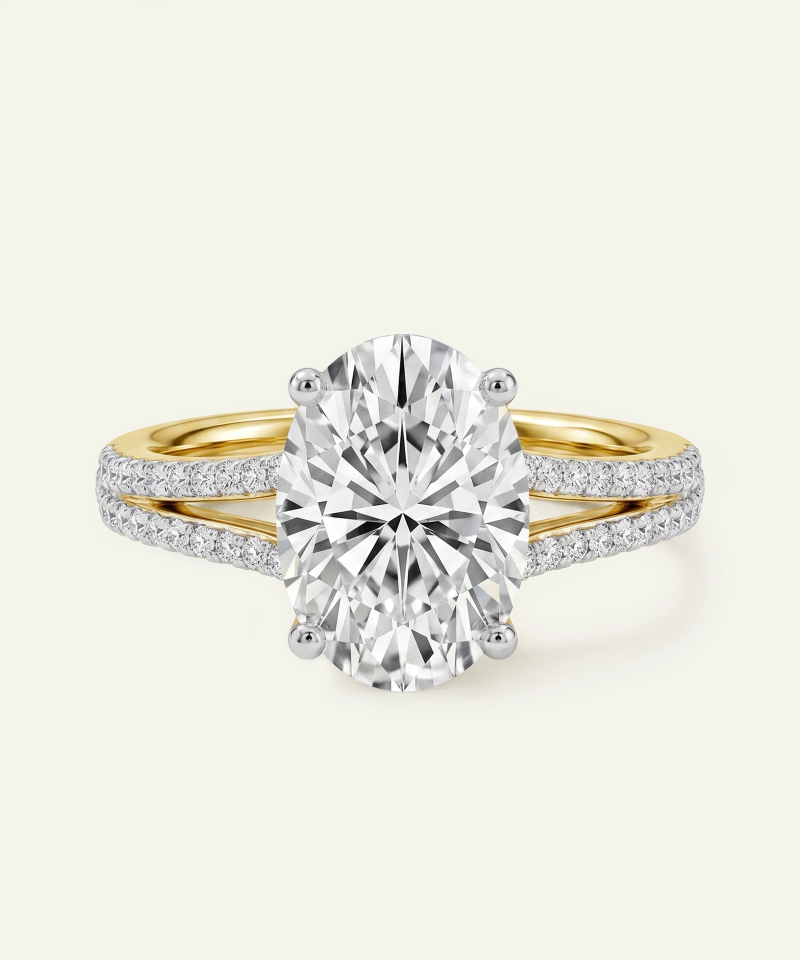 Oval-cut diamond ring with a yellow gold and pavé diamond split band.
