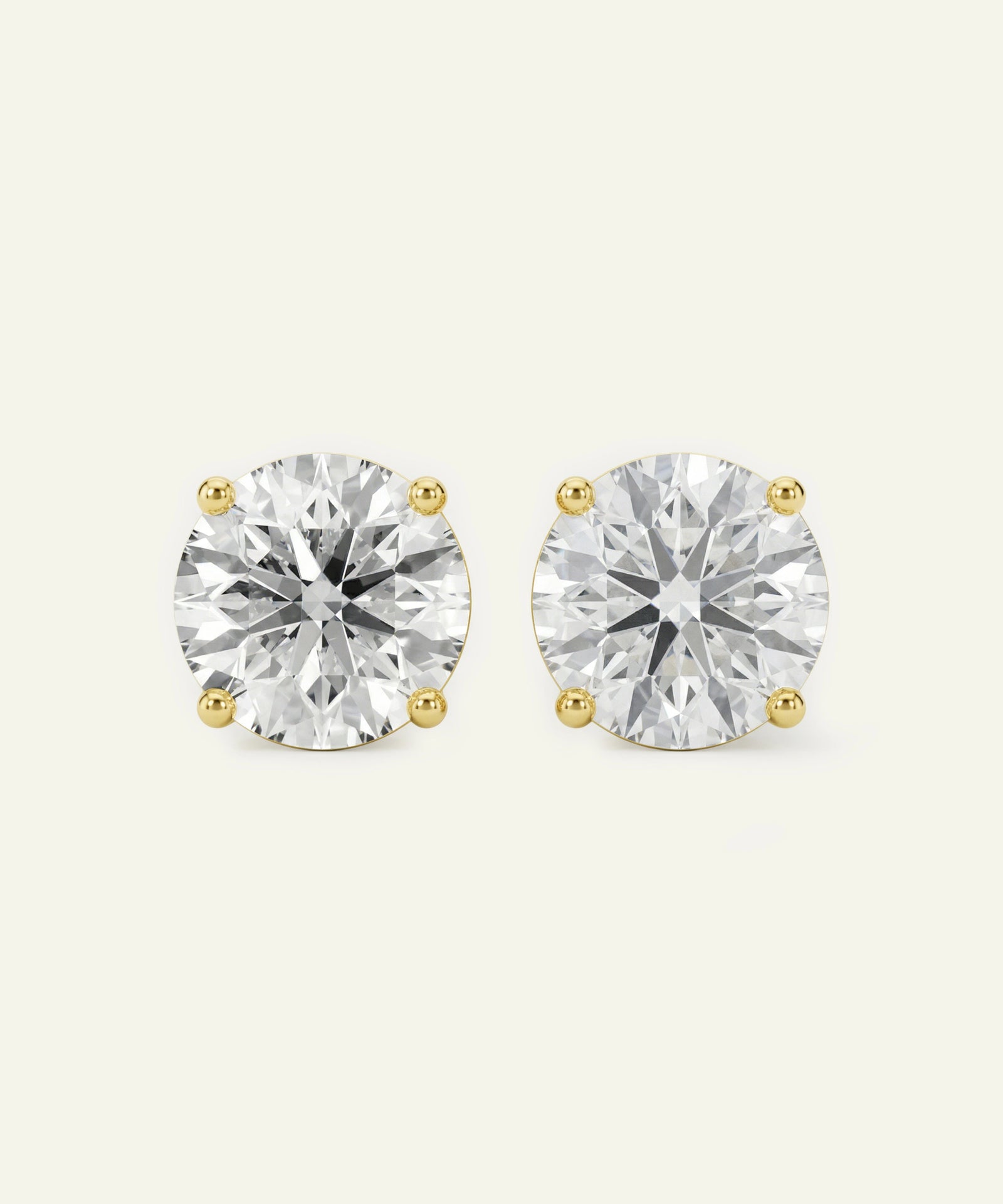 Pair of diamond stud earrings on a white background