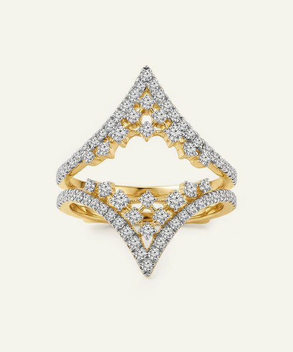 Gold and diamond ring with a geometric design on a light gray background