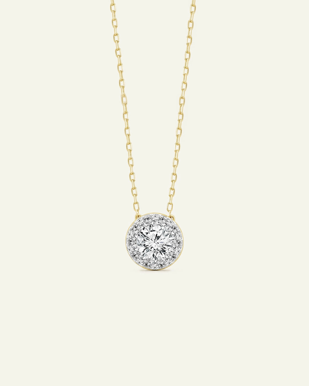 Gold necklace with a diamond pendant on a white background