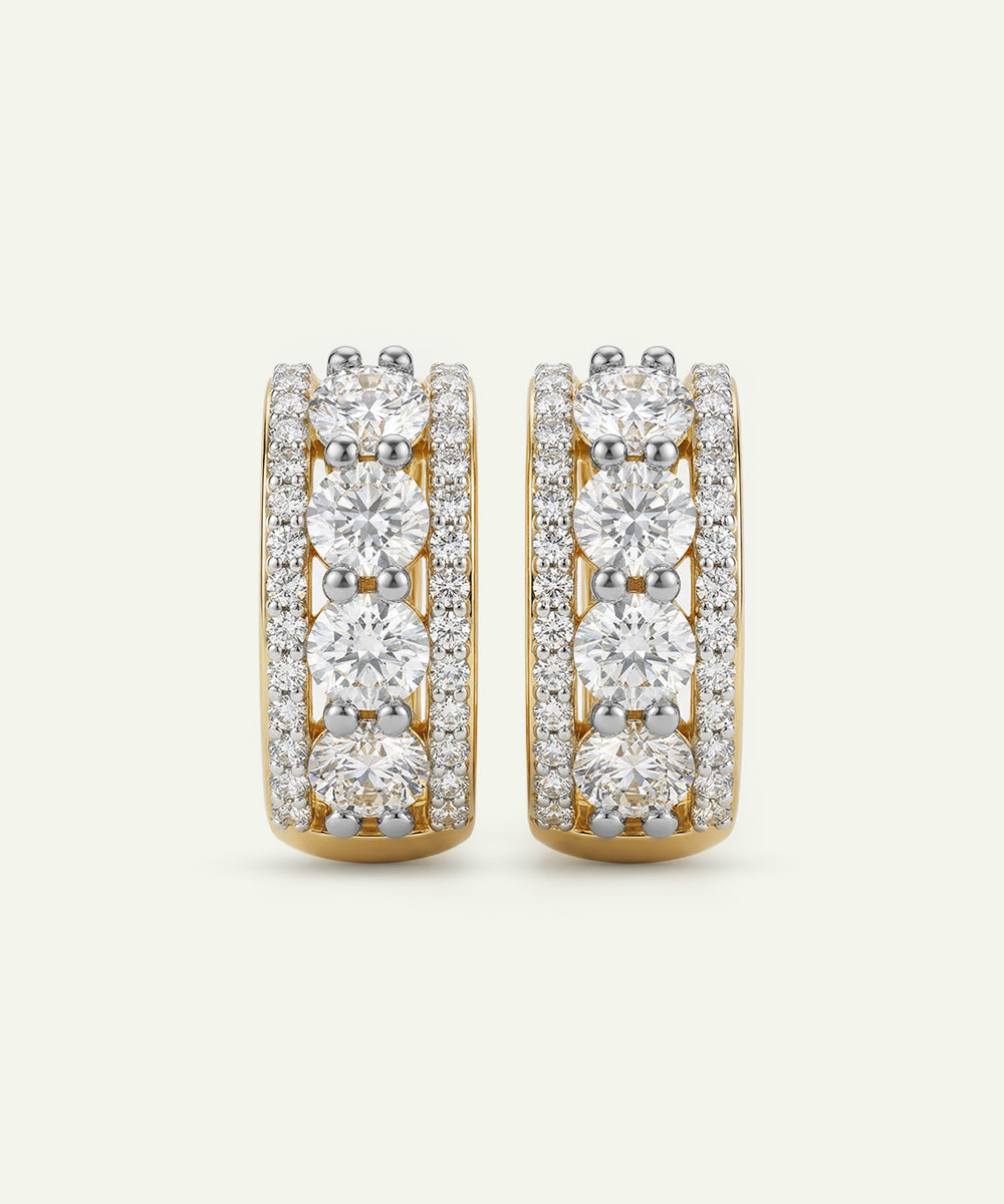 Pair of diamond hoop earrings on a light gray background