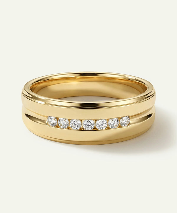 Gold ring with diamonds on a light background