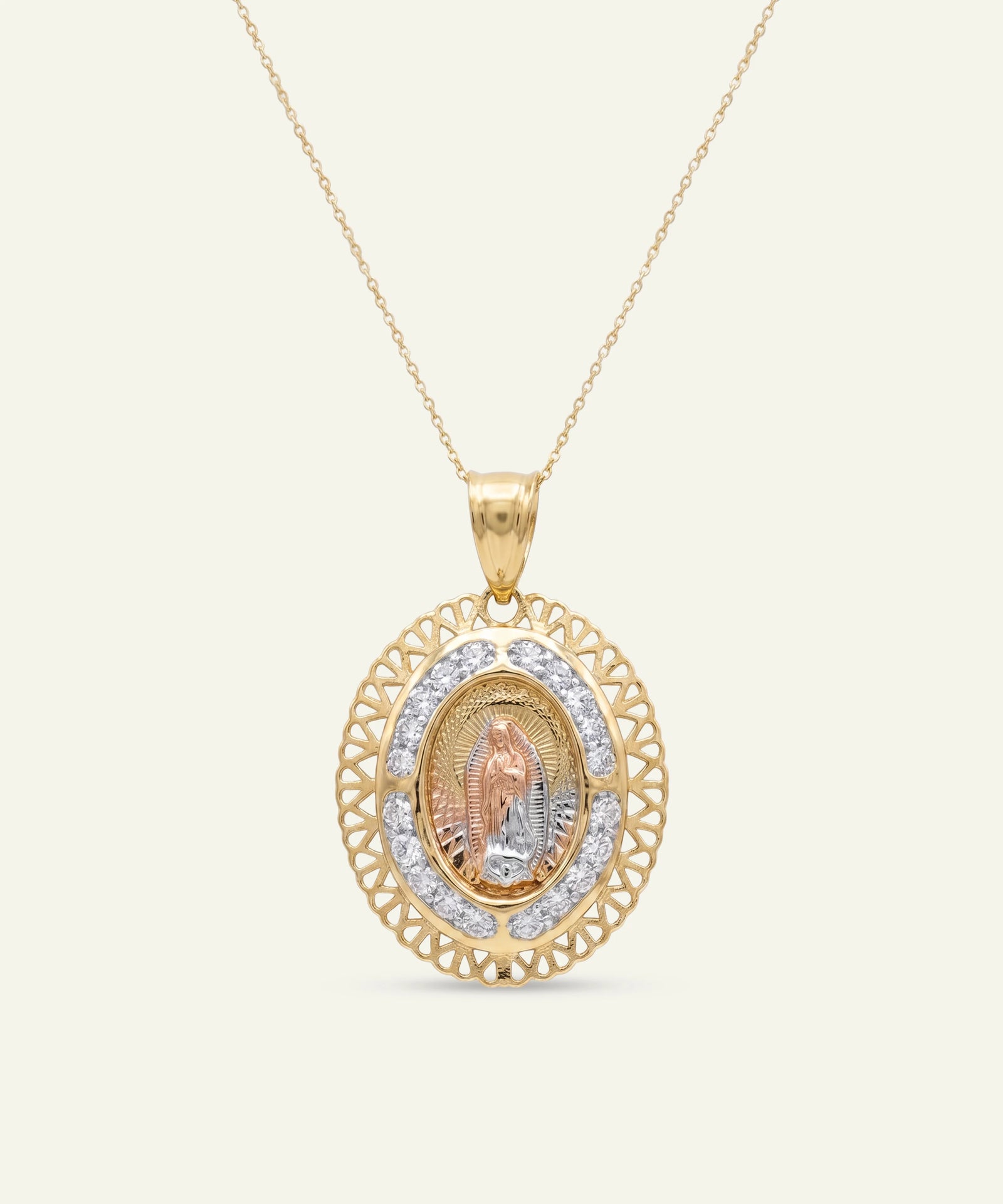 Gold necklace with a pendant on a white background