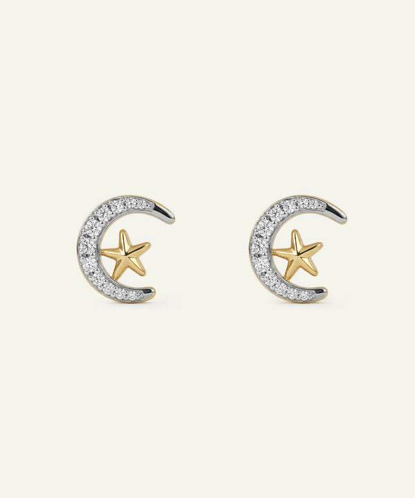 Pair of gold and silver earrings with star and crescent designs on a white background