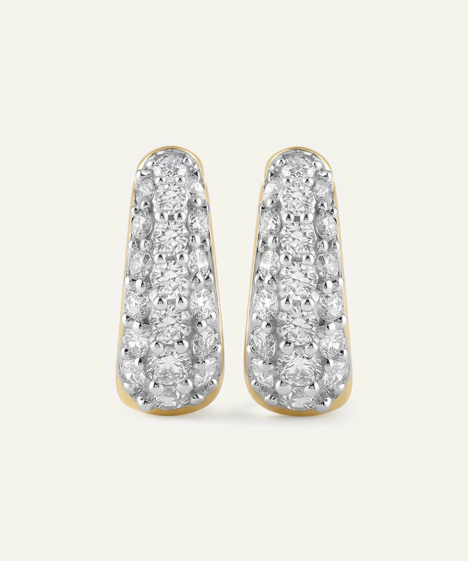 Pair of diamond earrings on a light gray background